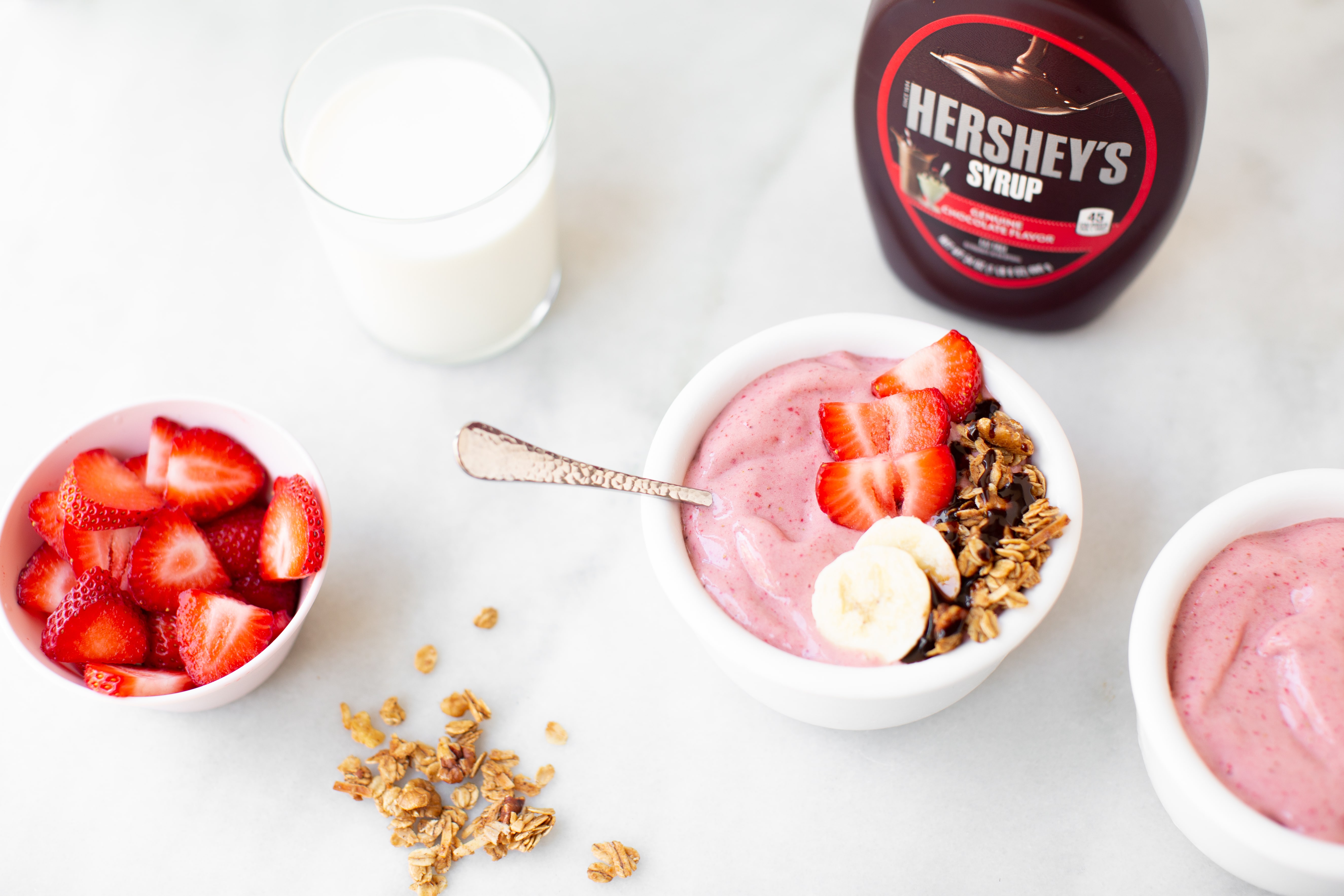 A Hershey’s strawberry banana smoothie bowl with real milk, strawberries, and Hershey’s syrup